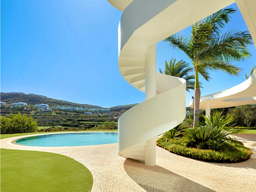 Spiral staircase in this curvaceous Finca Cortesin Villa