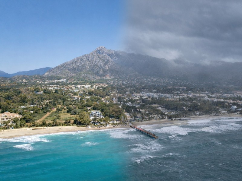 Coastal contrasts, sun and storm Coastal contrasts on the Costa del Sol, showing sunshine in one area and storm clouds in another.