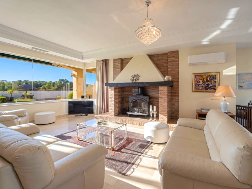 Family living room Living room with a feature fireplace in the Mijas Golf villa
